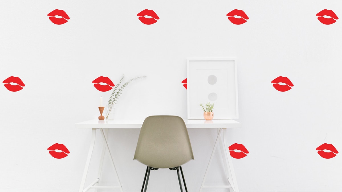 kiss theme wall decals with a table and chair in middle. 