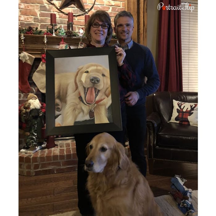happy dog parents with dog portrait