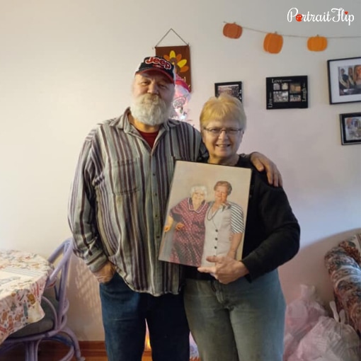 old couple with handmade portrait