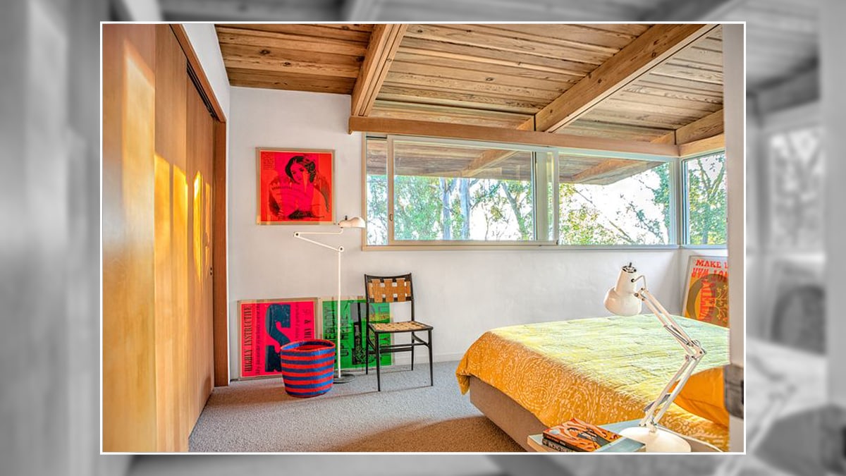 a colorful bedroom with a minimalist personality