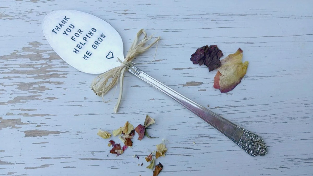 a spoon with "thank you for helping me grow" written on it. 