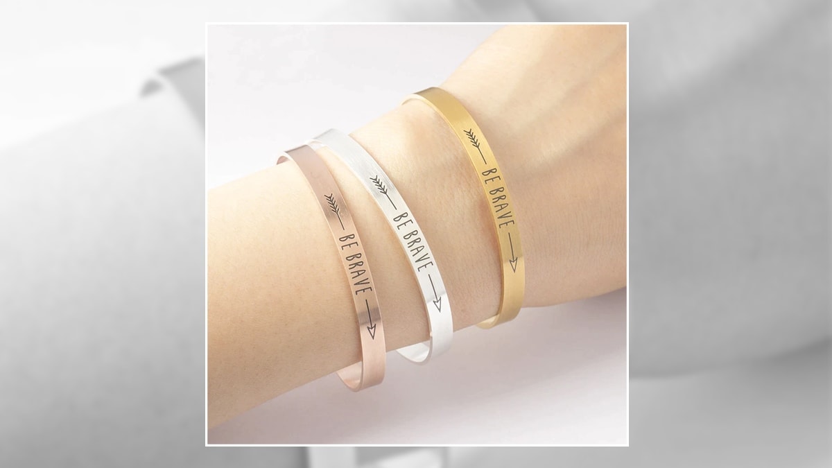 a woman wearing "Be Brave" bracelet
