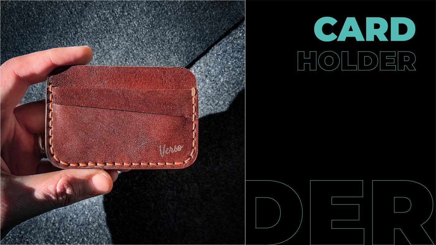 an arm holding a leather  business card holder 