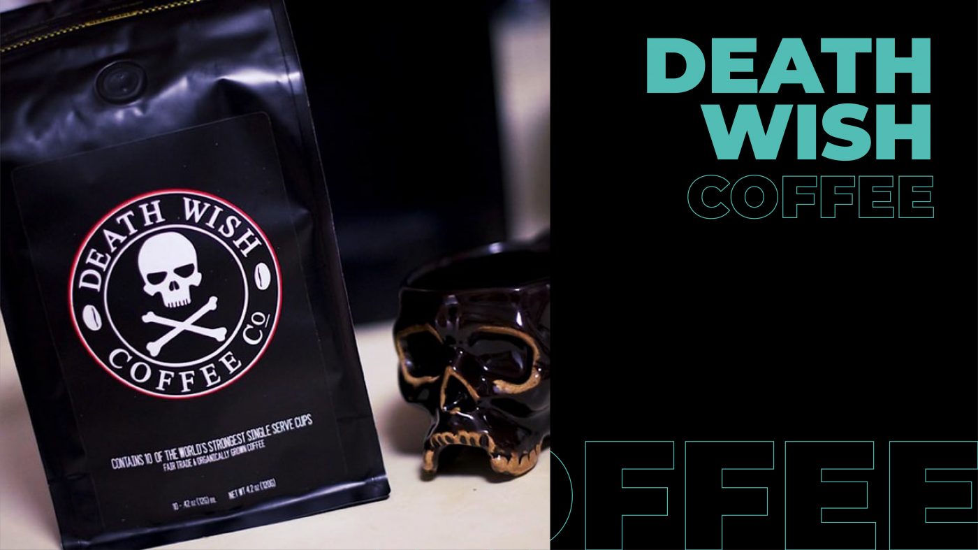 Death Wish coffee besides a fancy skull on a table. 