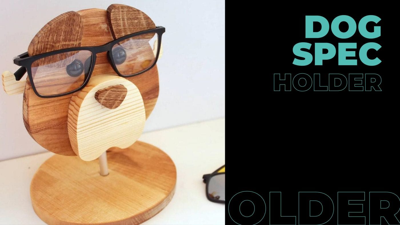 A cute brown wooden dog spec holder with glasses. 