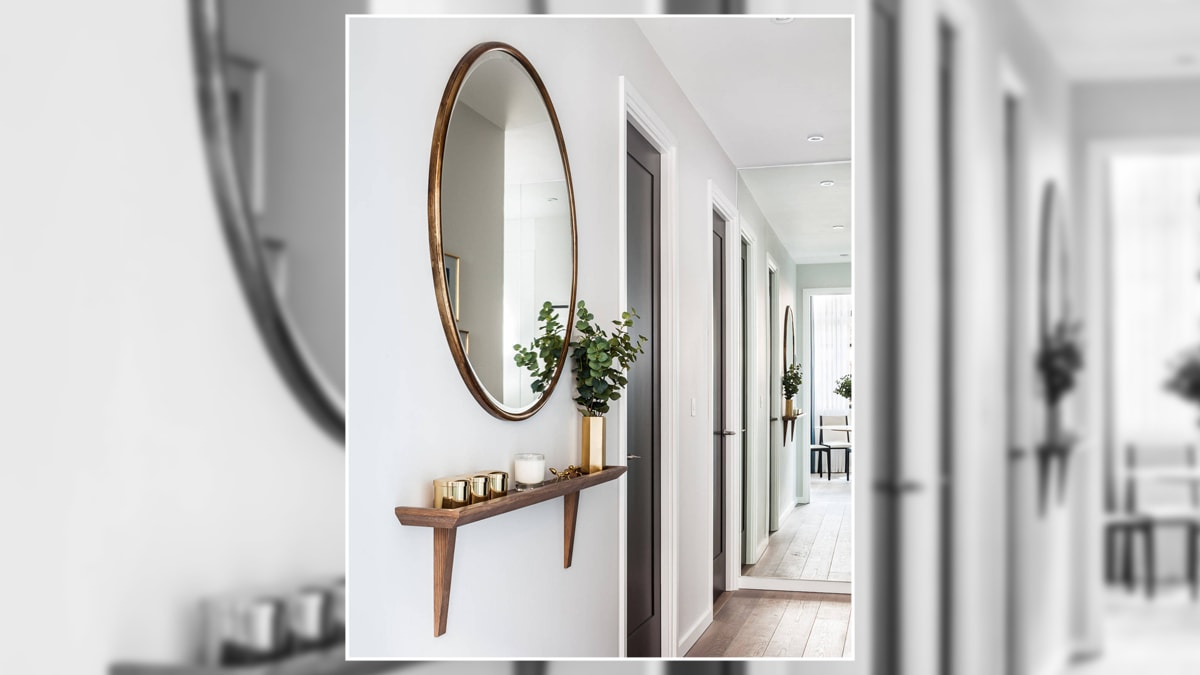 hallway decor with a mirror that gives a simple look