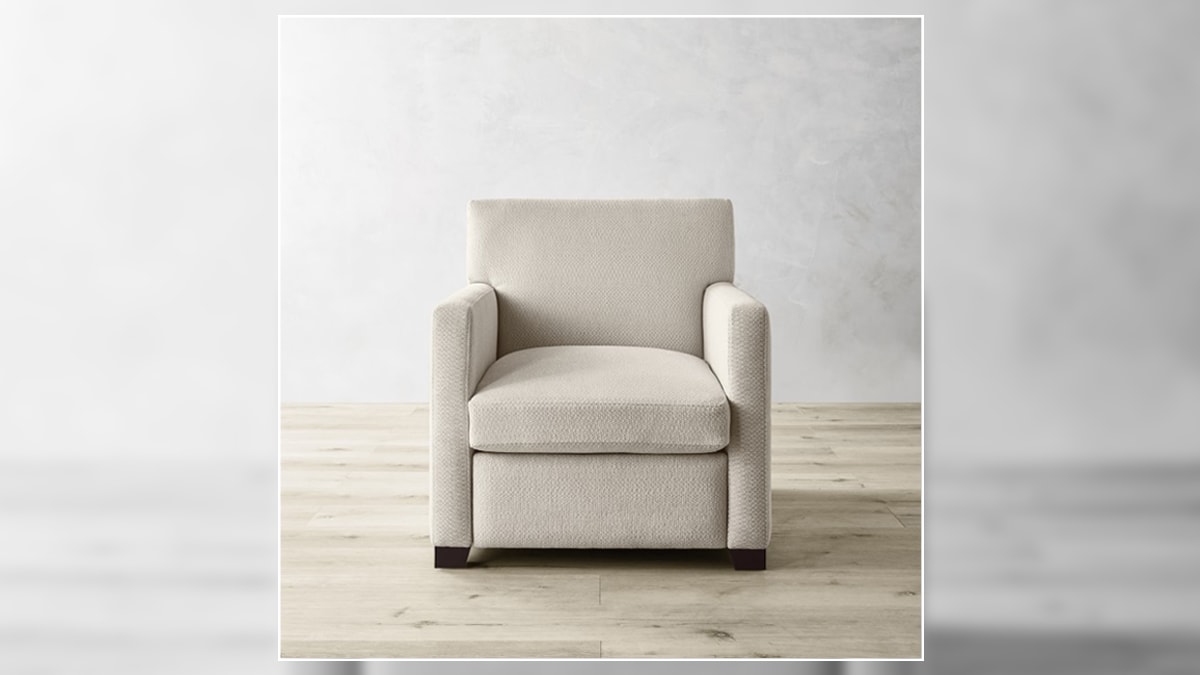 a grey cushioned chair 