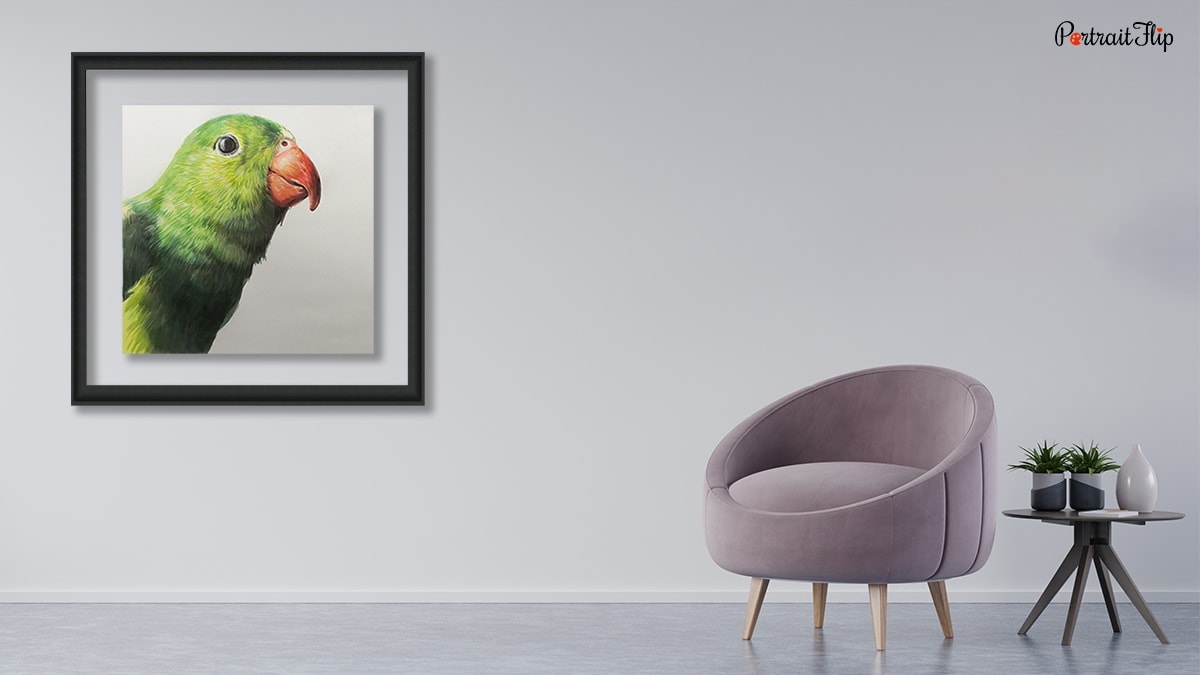A portrait of a bird that is hanging on a wall with a chair and table.