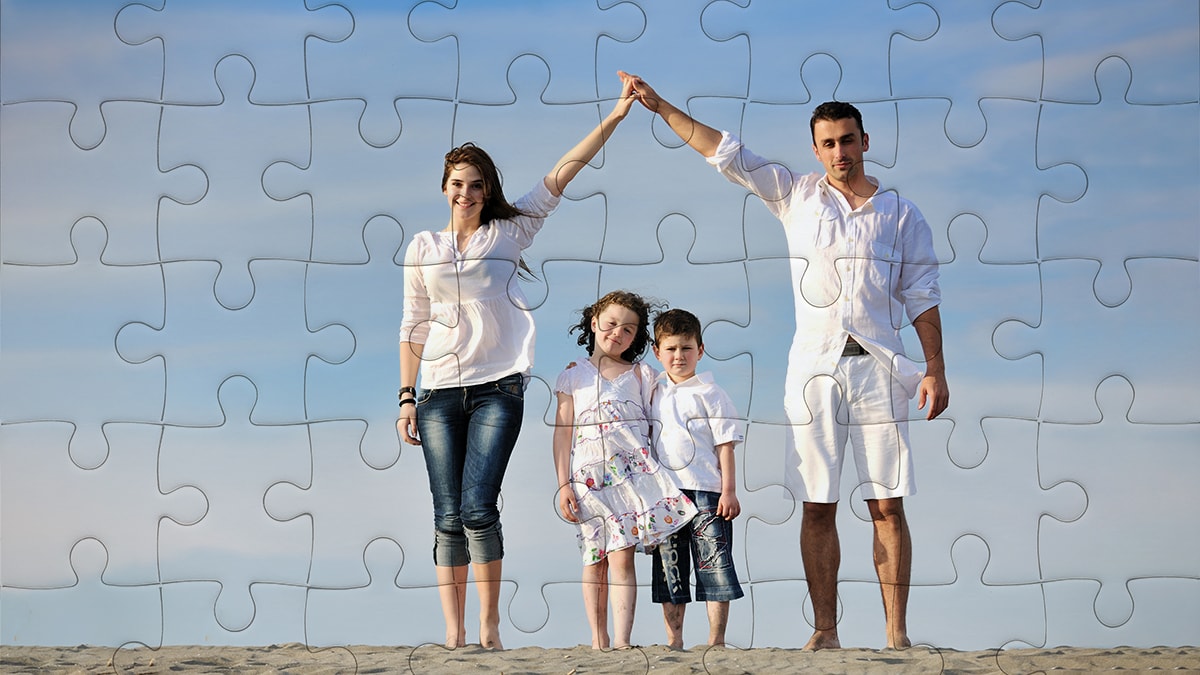 a jigsaw puzzle of a family photo with a couple and their two children. 