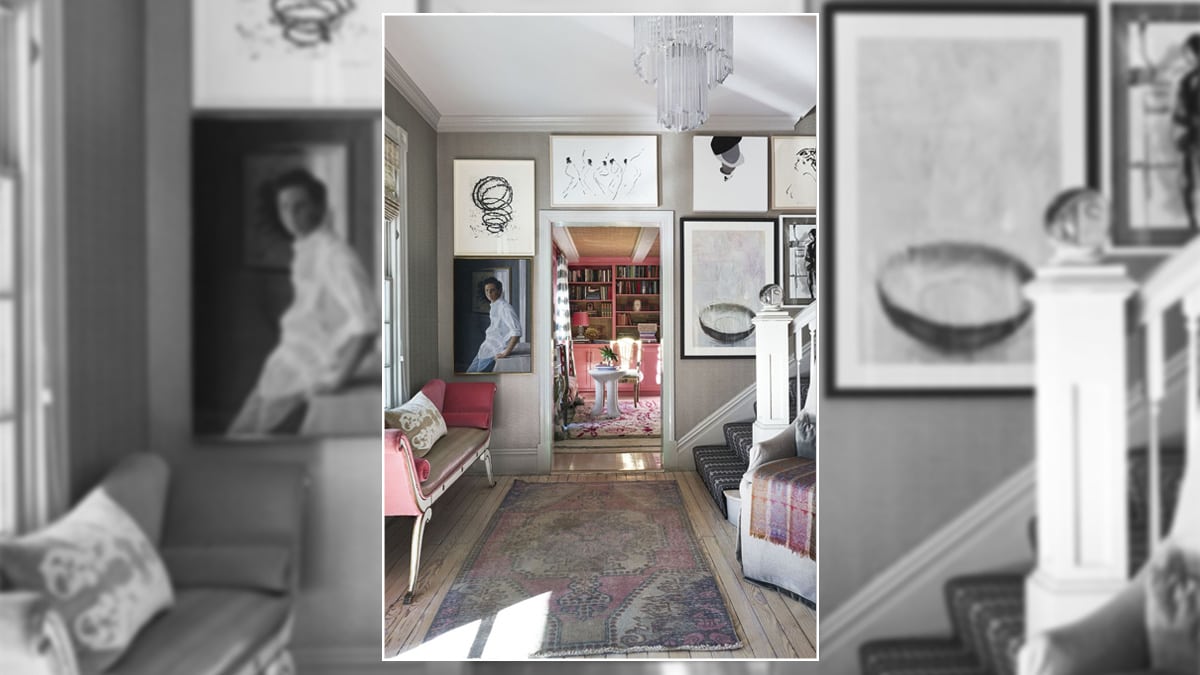 An entryway dominated by several artworks.