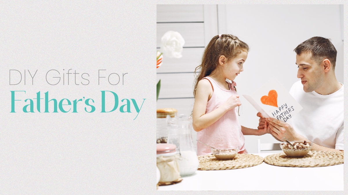 A daughter gifting her father a DIY card for fathers day