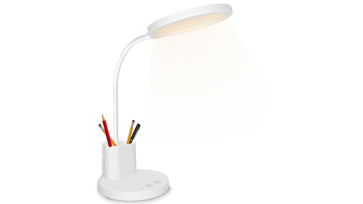 A desk with a pen holder