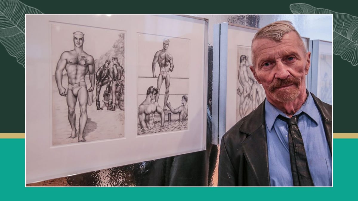 An artist standing next to his gay erotic art. there are two drawings and they are both erotic in nature. 
