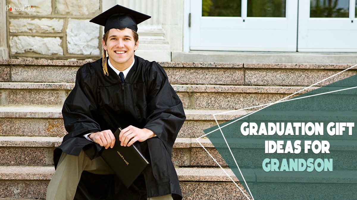 A guy sitting on some stairs smiling at the camera wearing a graduation gown and mortarboard hat holding a certificate in his hand. The text reads graduation gift ideas for grandson.