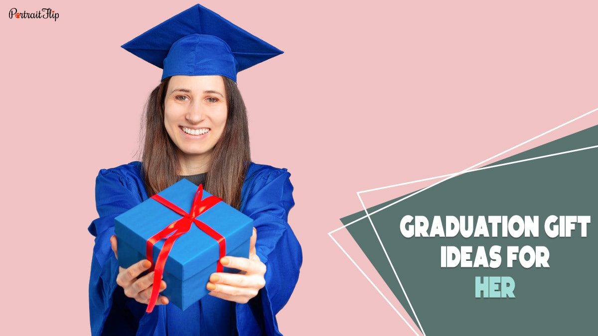 A girl wearing a blue mortarboard hat and a graduation gown holding a blue gift in her hand with a red ribbon and smiling. The text reads graduation gift ideas for her.