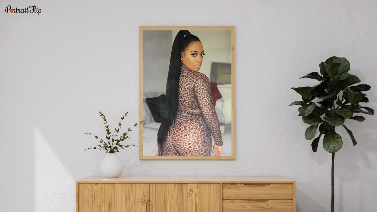 A Handmade custom oil painting of a lady that is set on a wall with pretty decorative pieces around. There are plants around and this is a gift the occasion of her 18th birthday.
