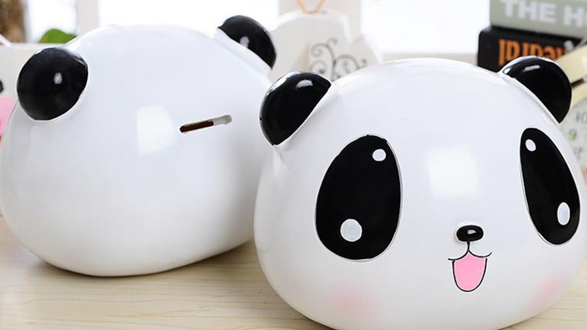 A piggy bank in the shape of a panda that is an unusual gift for pet lovers.