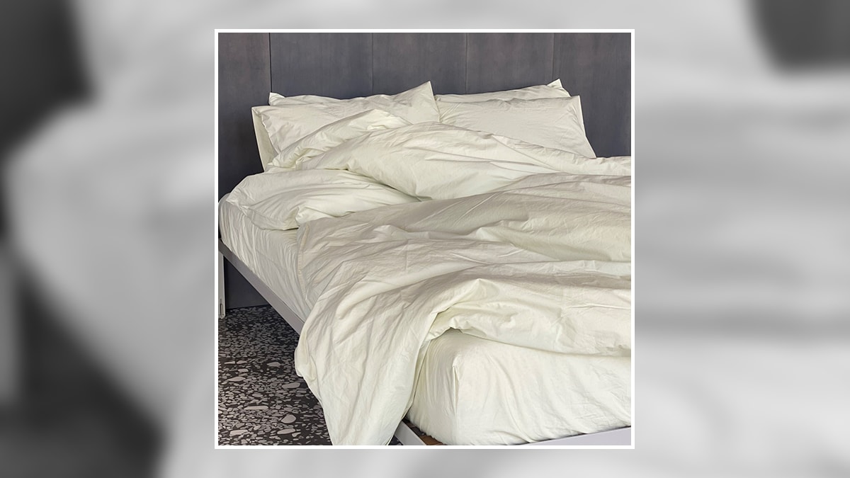 a bed with percale sheets. 