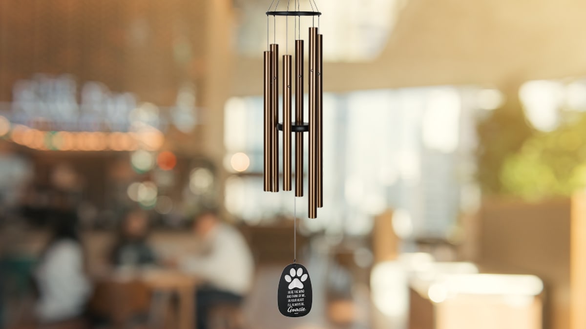 An image of a wind chime with a wooden block with their name and a quote. A gift for a pet lover.