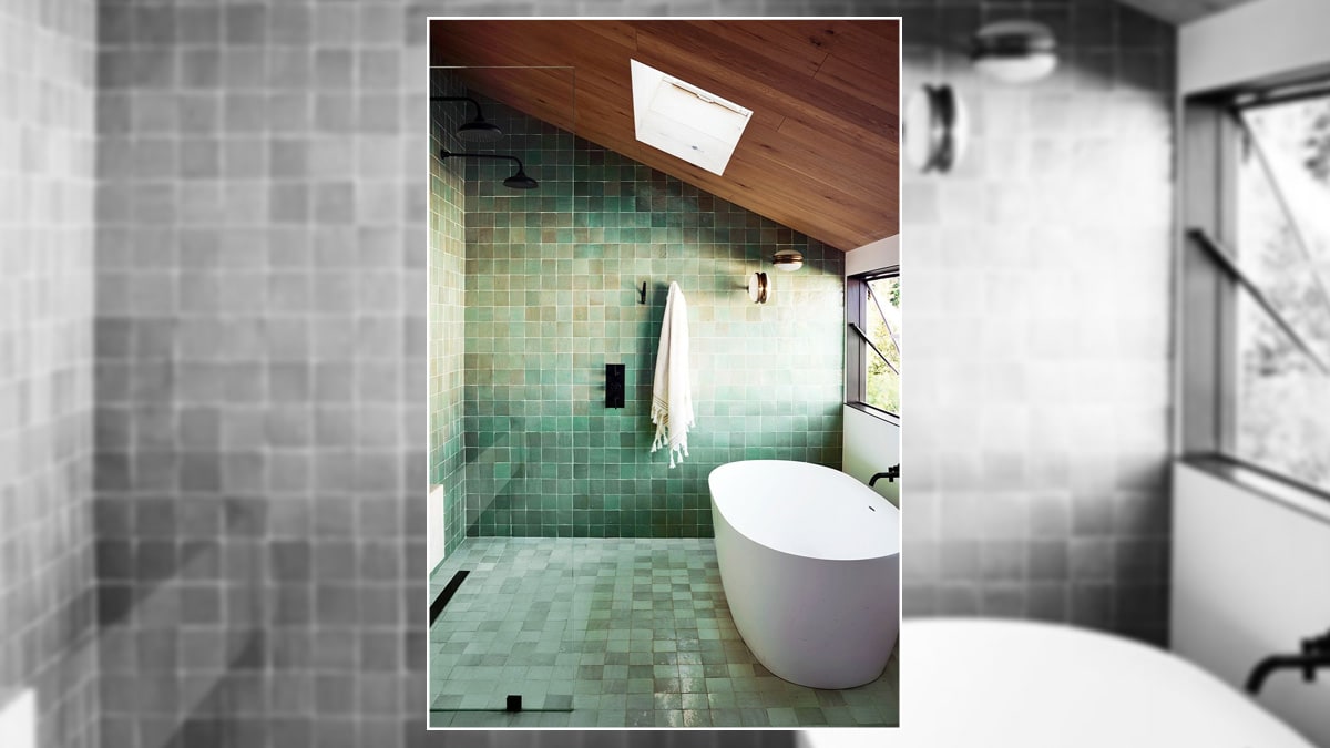Modern bathroom space with a wooden sloped ceiling and fancy light fixtures.