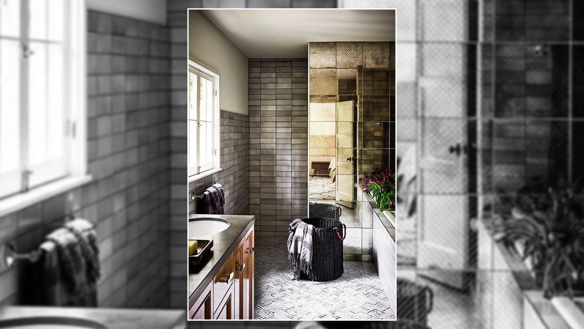 A modern bathroom with off-brown walls and off-white sinks and mirror frames.