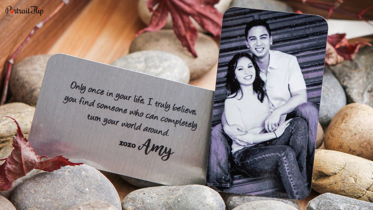 A metal card that has a picture of a couple and it reads only once in your life, I truly believe you find someone who can completely turn your world around. Xoxo Amy.