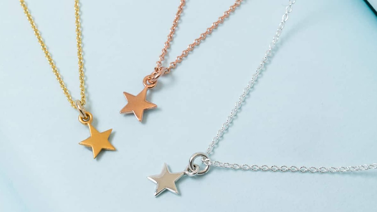 Custom star necklaces in three different colors golden, silver and rose gold. They have beautiful star lockets attached to tiny chain strings.