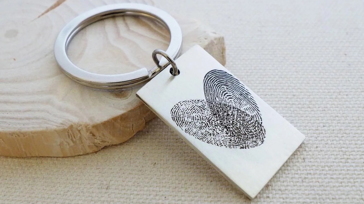 A finger print key chain is a gift for a person who is grieving the loss of a father.