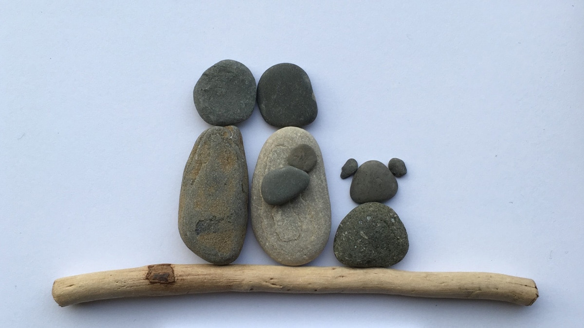 cute little pebble portrait of two people and a pet. It is also a gift for memorial of pets.