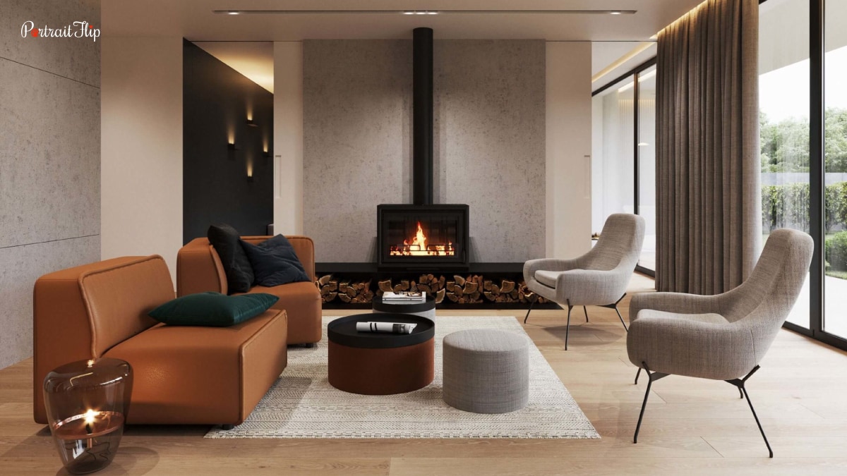 An interior of a house with a fireplace and furniture in earthy tones. The walls are also painted in such earthy tones. These are some trends in home decor 2022.
