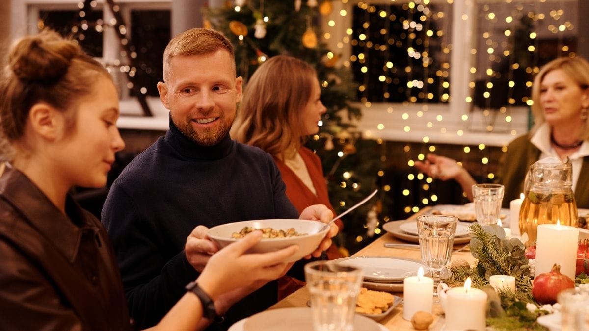 A proposal at a family dinner shown as one of the best proposal ideas