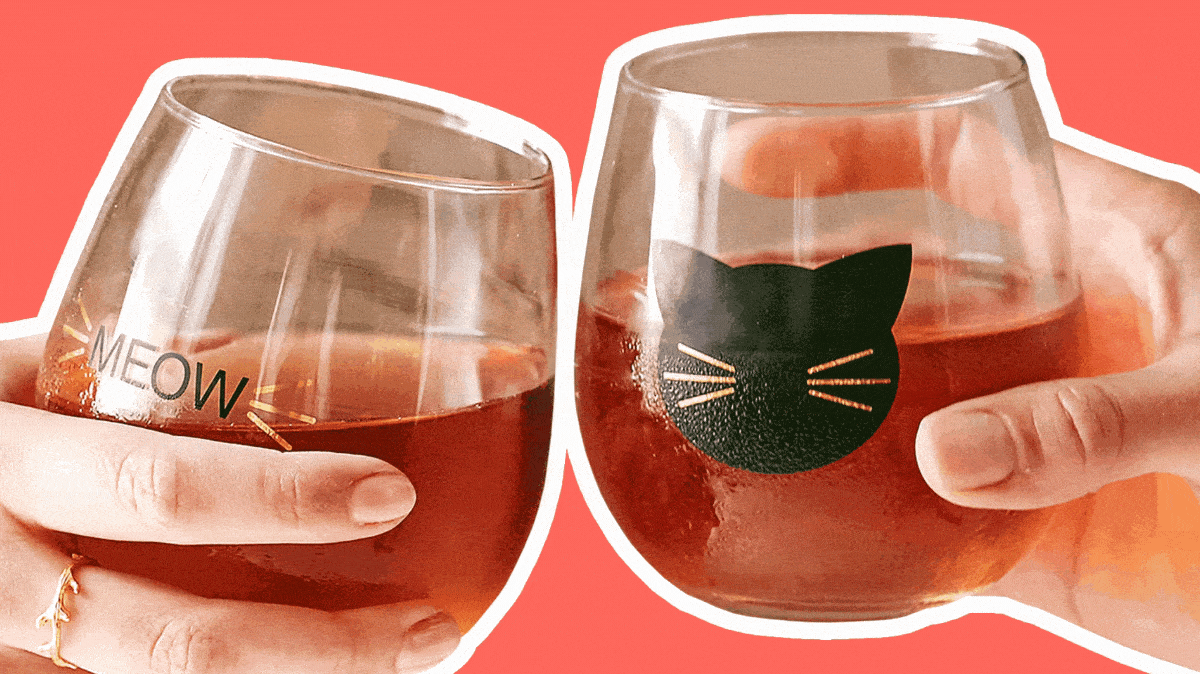 pair of cat themed wine glasses shown clinking