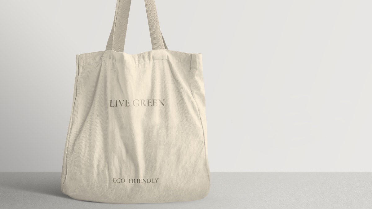 Reusable pure cotton bag that has a text that reads live green and eco friendly