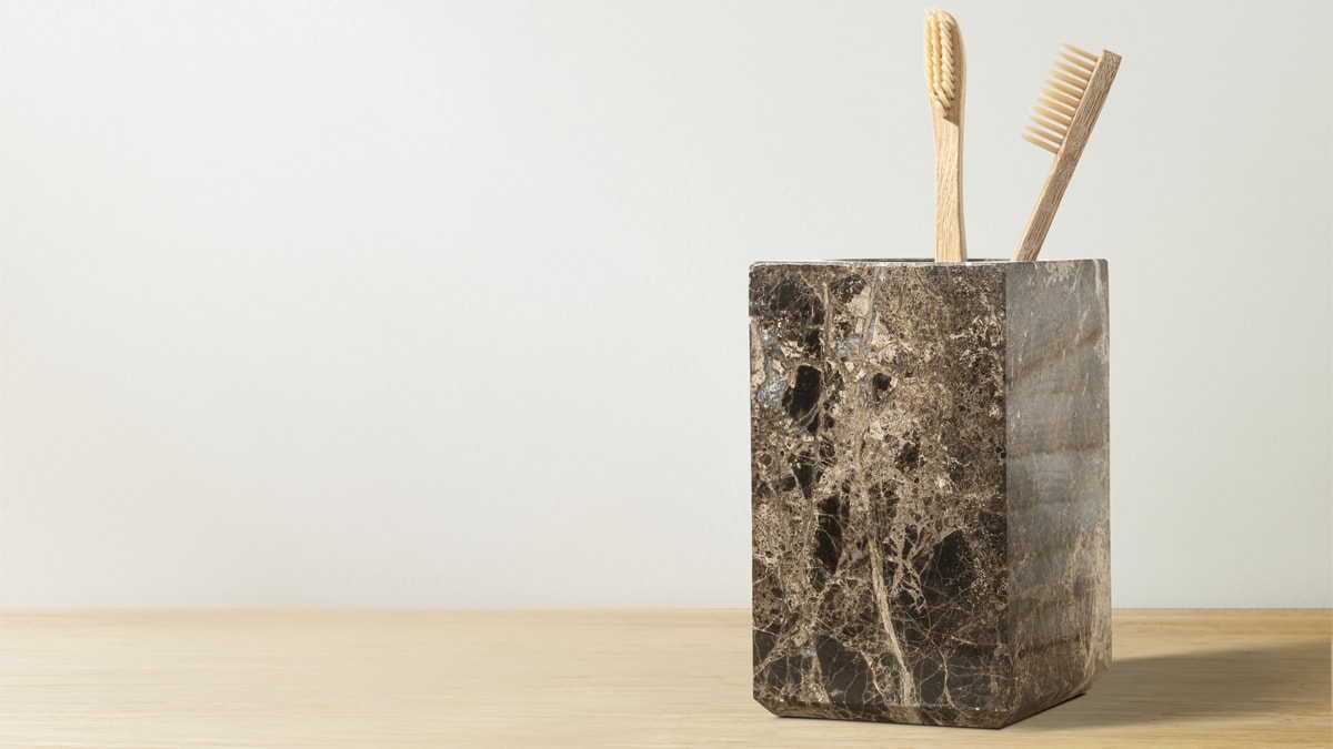 Wooden tooth brushes placed in a marble holder
