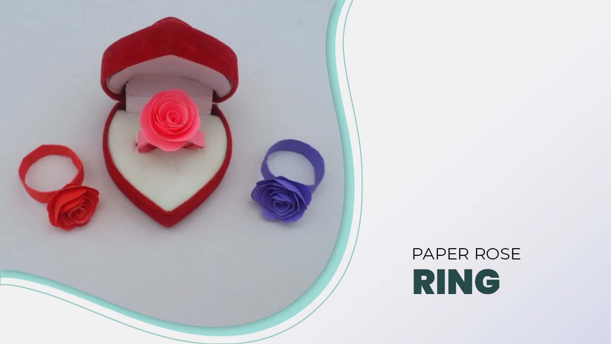 3 paper rose ring. One paper rose ring is in the red heart shaped box. 