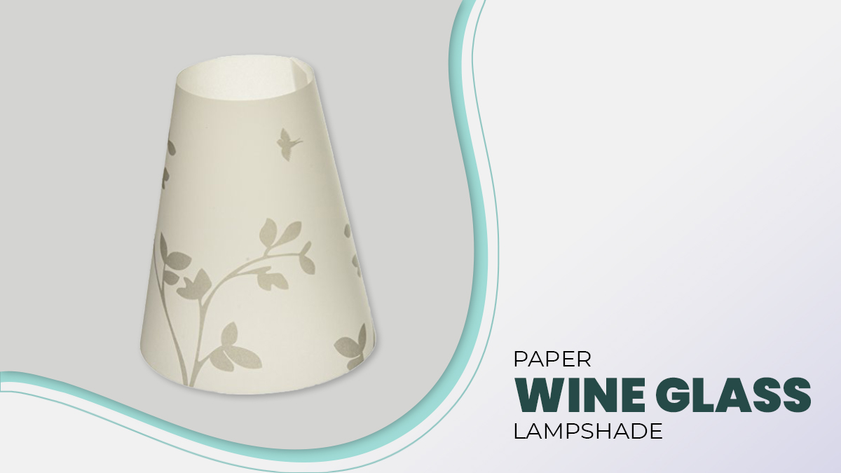 Paper wine glass lampshade on a white surface. 