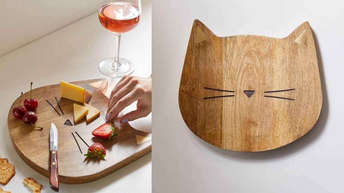 a cat shaped cutting and cheese board shown in the image