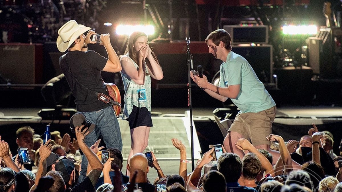 A proposal at a live concert shown as one of the best proposal ideas