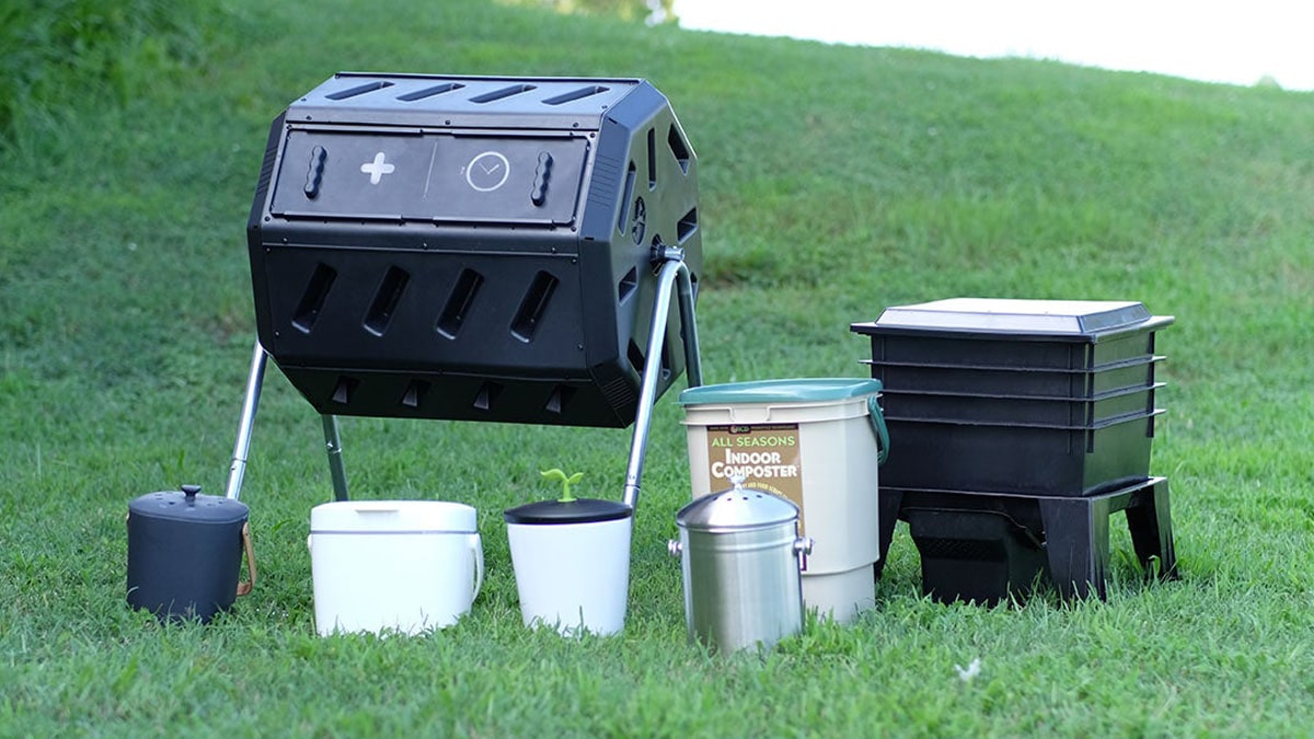 A complete compost bin kit placed a garden backyard for waste disposal