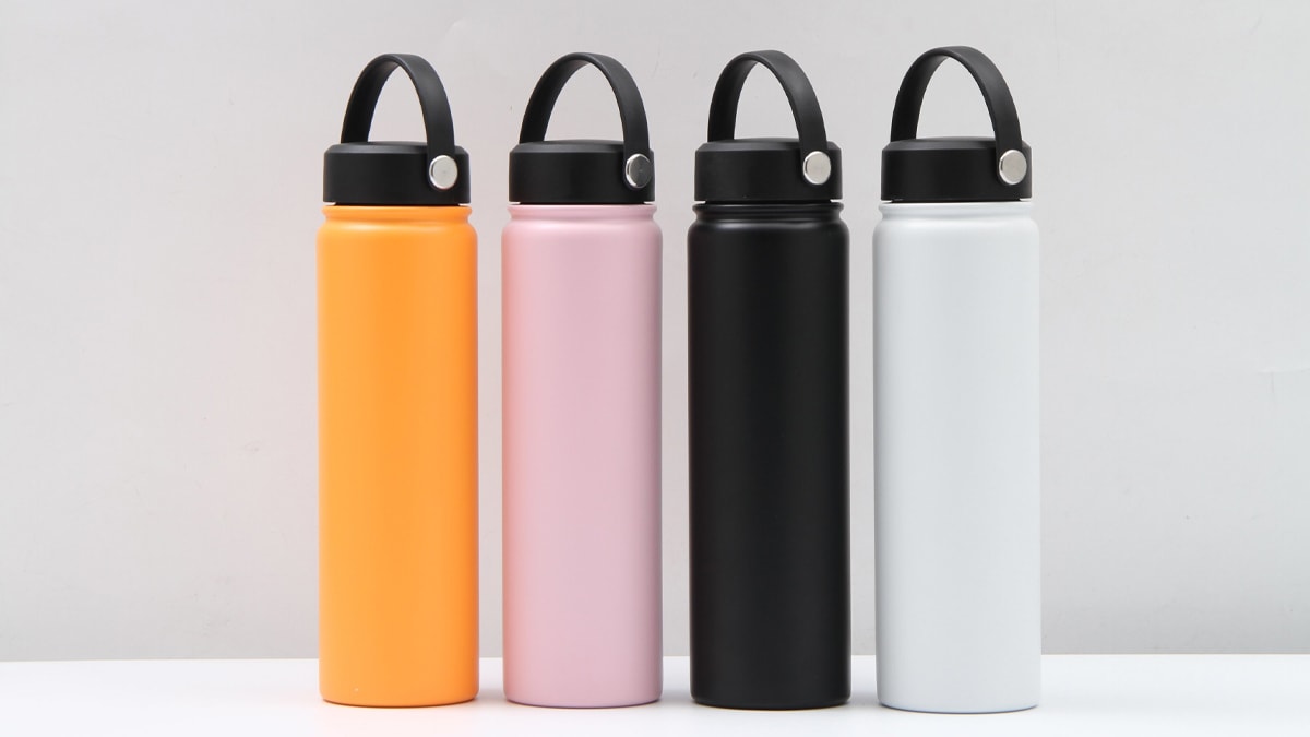 Stainless steel water bottles in different colors like yellow, pink, black and white