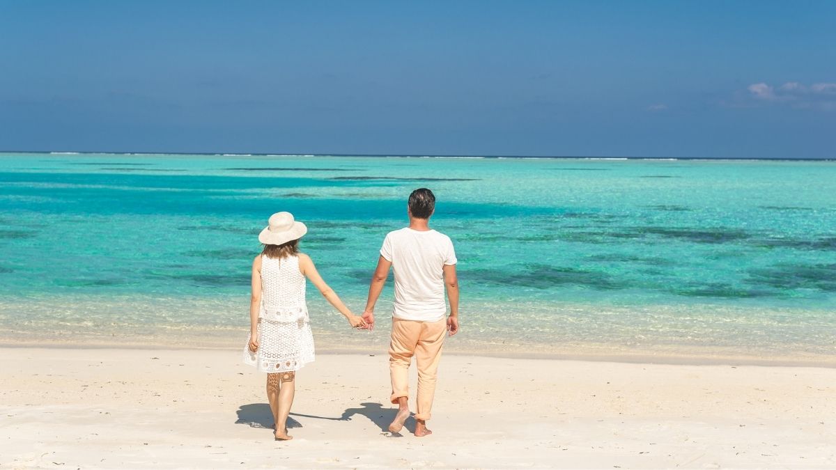 a couple enjoying a vacation on a beach