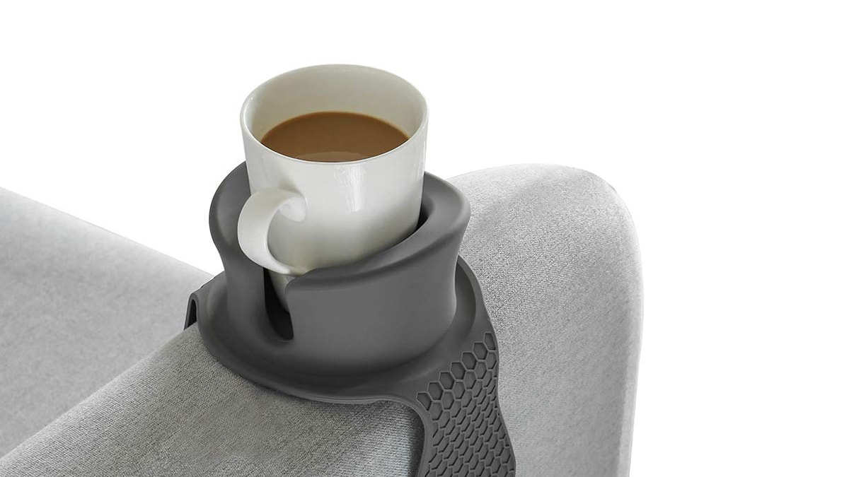a cup of tea on a couch coaster.
