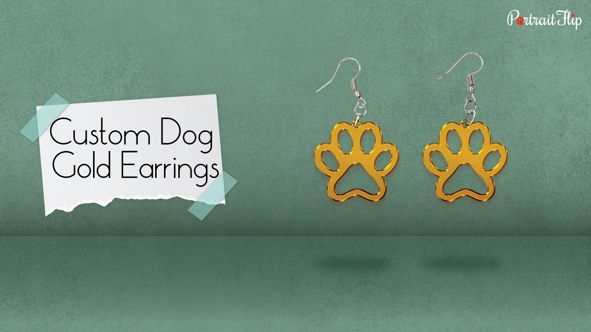 a pair of dog gold earrings