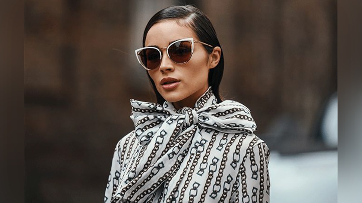 a stylish woman with designer sunglasses