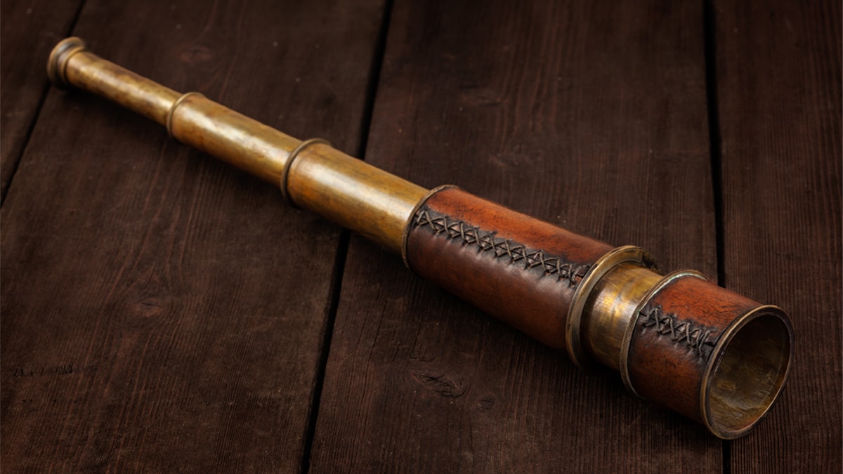 Monocular on a wooden surface