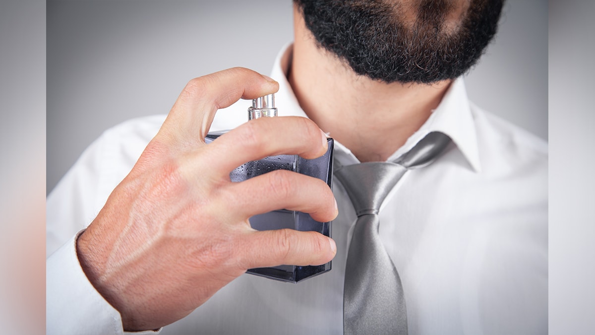 a man spraying natural deodorant 