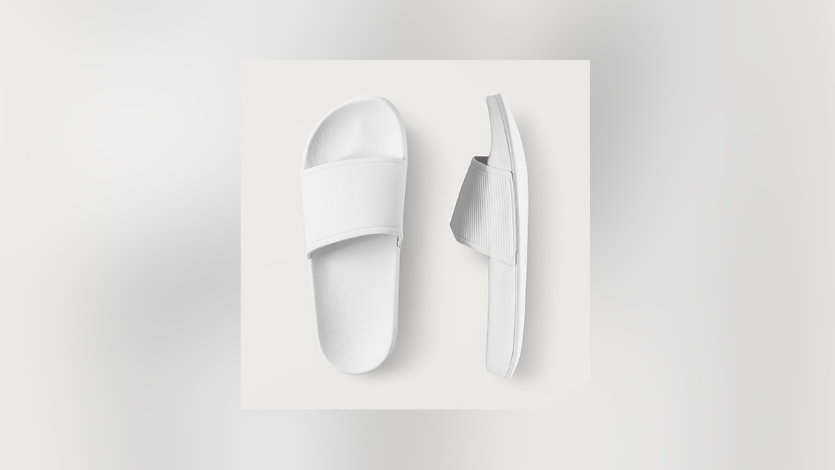 a pair of slippers on a white surface. 