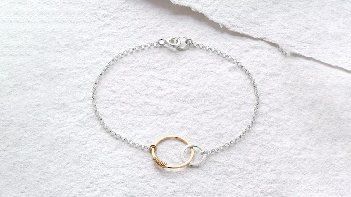 a bracelet on a white surface