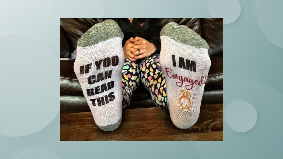 a pair of socks with quirky messages