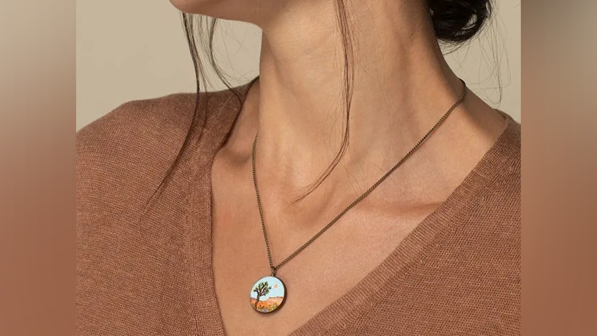 a girl with a nature inspired necklace